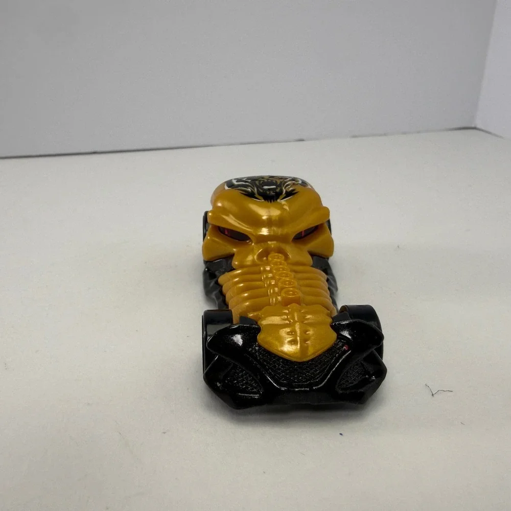 Hot Wheels Skull Crusher 2009 Mattel Gold Black Skeleton Diecast Car 1:64 Scale